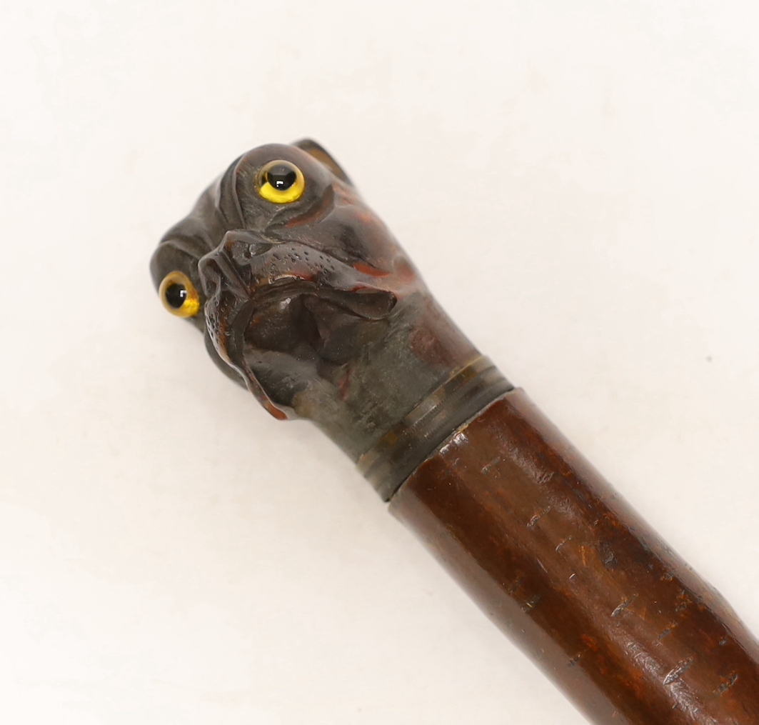 A treen Bulldog head letter opener, c.1900, with glass eyes and metal collar, 27.5cm long